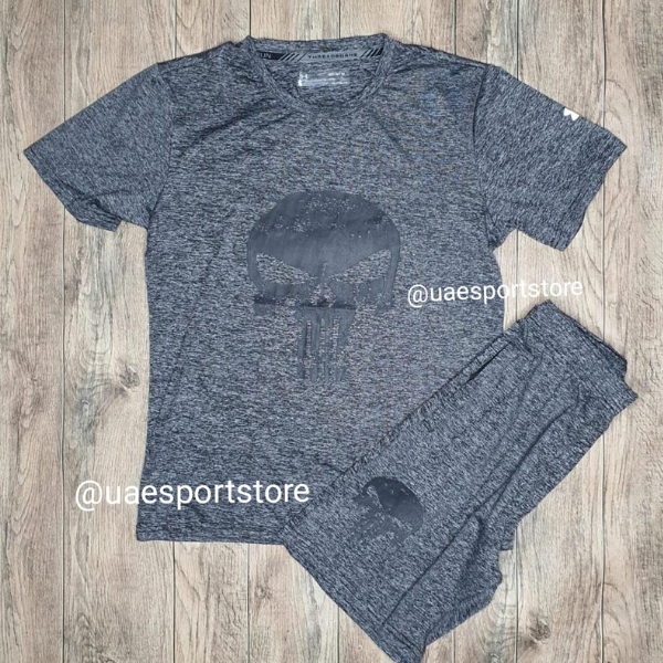Untitleddesign_15_e63bdc1e-2472-4363-baec-db9c8d42f087 | UAE SPORT STORE Dark heather gray athletic t-shirt and shorts set on a wooden floor, featuring a subtle skull logo; watermark @uaesportstore.