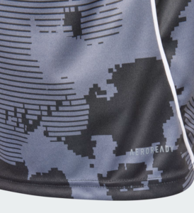 Close-up of blue and black digital camo fabric with white piping and the AEROREADY logo visible at the hem.