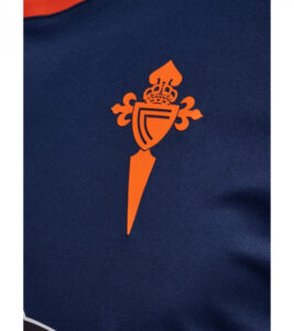 Orange heraldic dagger emblem with crown and shield design on a dark blue fabric (athletic jersey).