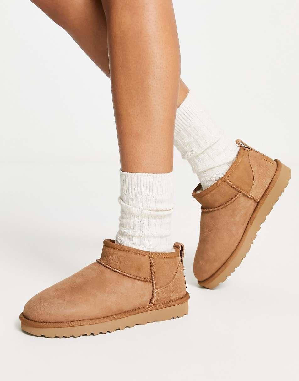 WhatsAppImage2025-01-11at10.19.43 | UAE SPORT STORE Tan suede ankle boots with a light tan sole and ridged tread, worn with white knit socks on a plain background.