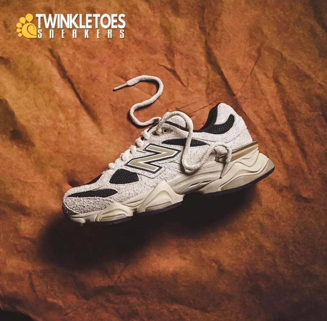 WhatsApp_Image_2024-07-27_at_01.11.40 | UAE SPORT STORE White/gray athletic sneaker on a brown textured backdrop with Twinkletoes Sneakers logo in the corner, product shot.
