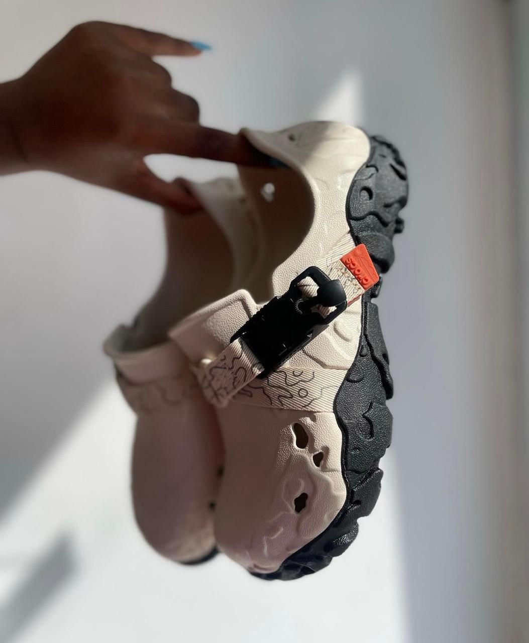 WhatsApp_Image_2024-09-07_at_11.22.28 | UAE SPORT STORE Beige sandal with a thick black traction sole and side buckle, shown from the side.