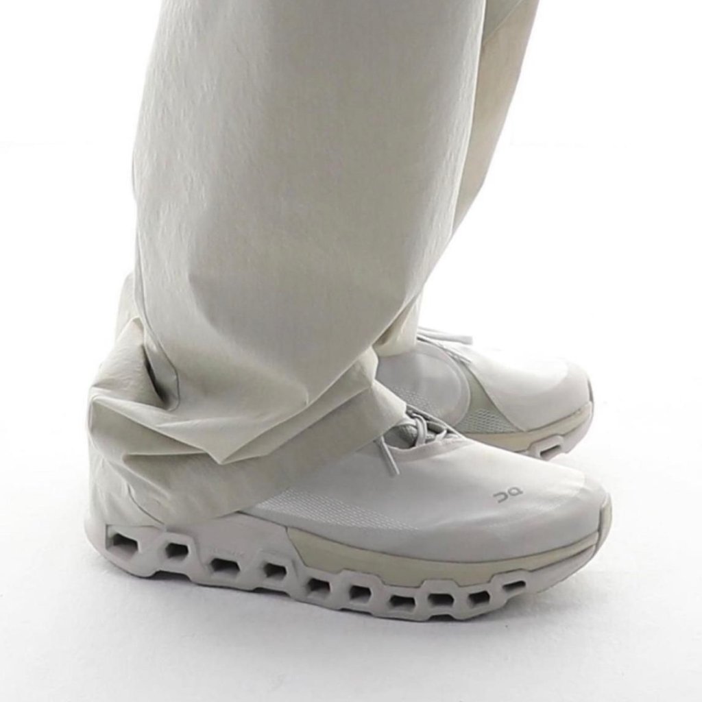 WhatsApp_Image_2024-11-12_at_16.50.06 | UAE SPORT STORE Close-up of white athletic shoes with a hollow, segmented sole and light gray accents.