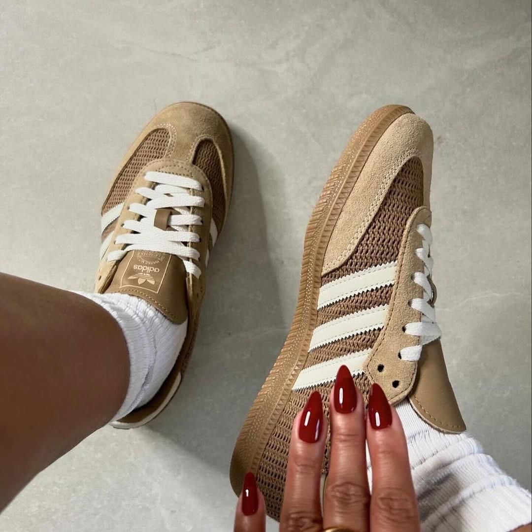 WhatsApp_Image_2025-01-15_at_11.49.13 | UAE SPORT STORE Beige Adidas sneakers with white stripes worn with white socks, viewed from above.
