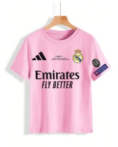 Pink Real Madrid football shirt on hanger with Emirates Fly Better sponsor and club crest on the chest, plus patches on the sleeve.