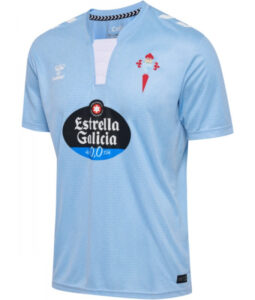 Light blue football jersey with short sleeves, featuring the Estrella Galicia sponsor logo on the chest and a club crest on the left side.