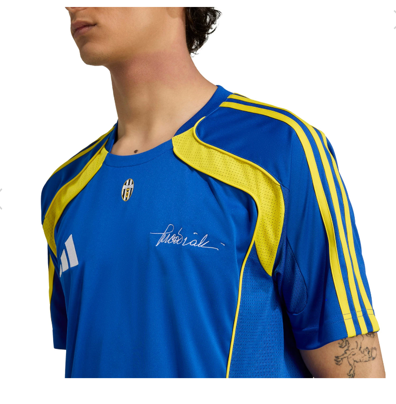 Y | UAE SPORT STORE Blue athletic jersey with yellow shoulder stripes and sleeve piping, featuring a small crest and a scripted signature on the chest.