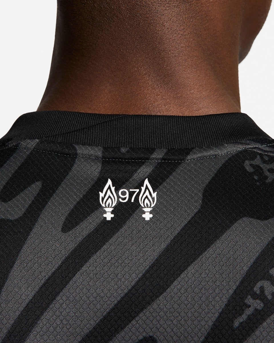 ZYye70s2Xc4RG7A_b225701c-06ed-42e9-ba66-2772b9da88be | UAE SPORT STORE Back view of a black and gray striped athletic shirt with a white '97' logo flanked by two flame icons and female gender symbols on the collar area.