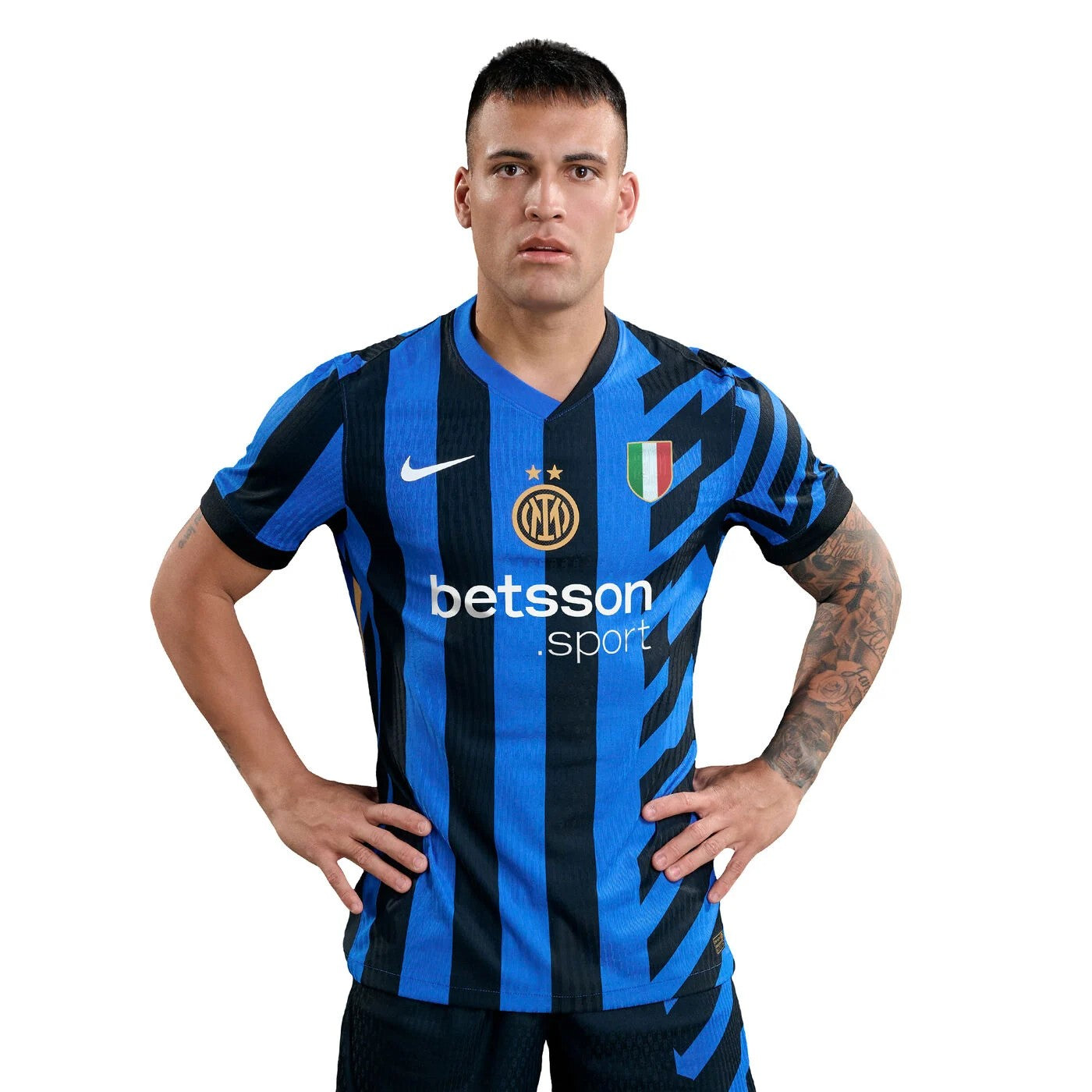 ZdWY03bzJkE5LWf | UAE SPORT STORE Soccer player in Inter Milan blue and black striped jersey with Betsson sponsor, hands on hips, facing camera.