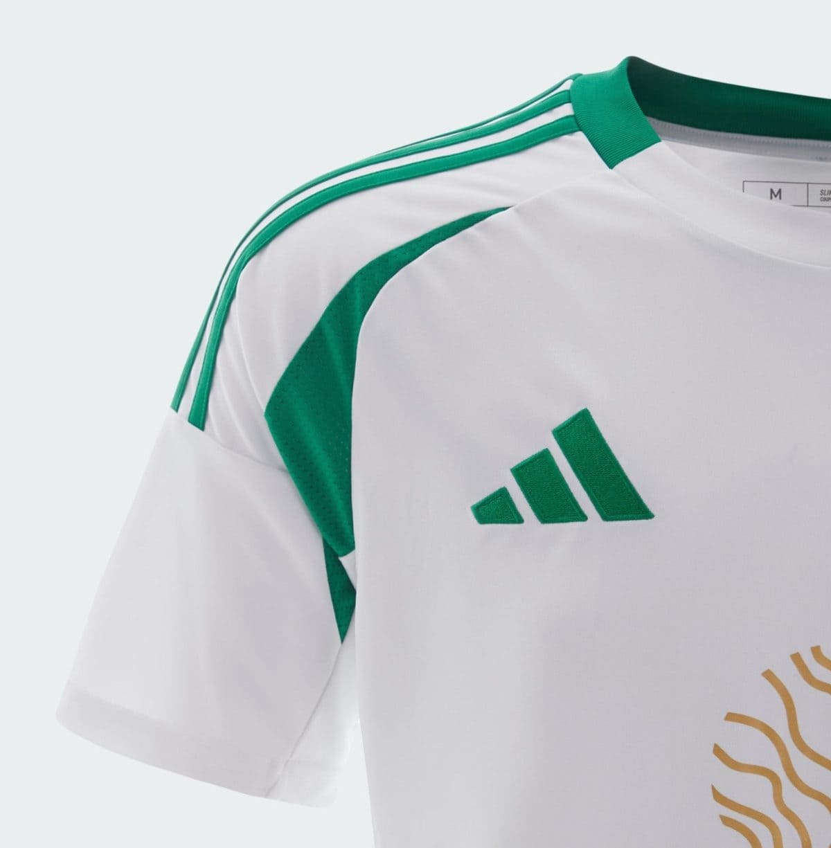 Close-up of a white sports jersey with green Adidas stripes on the shoulder and a green Adidas logo.