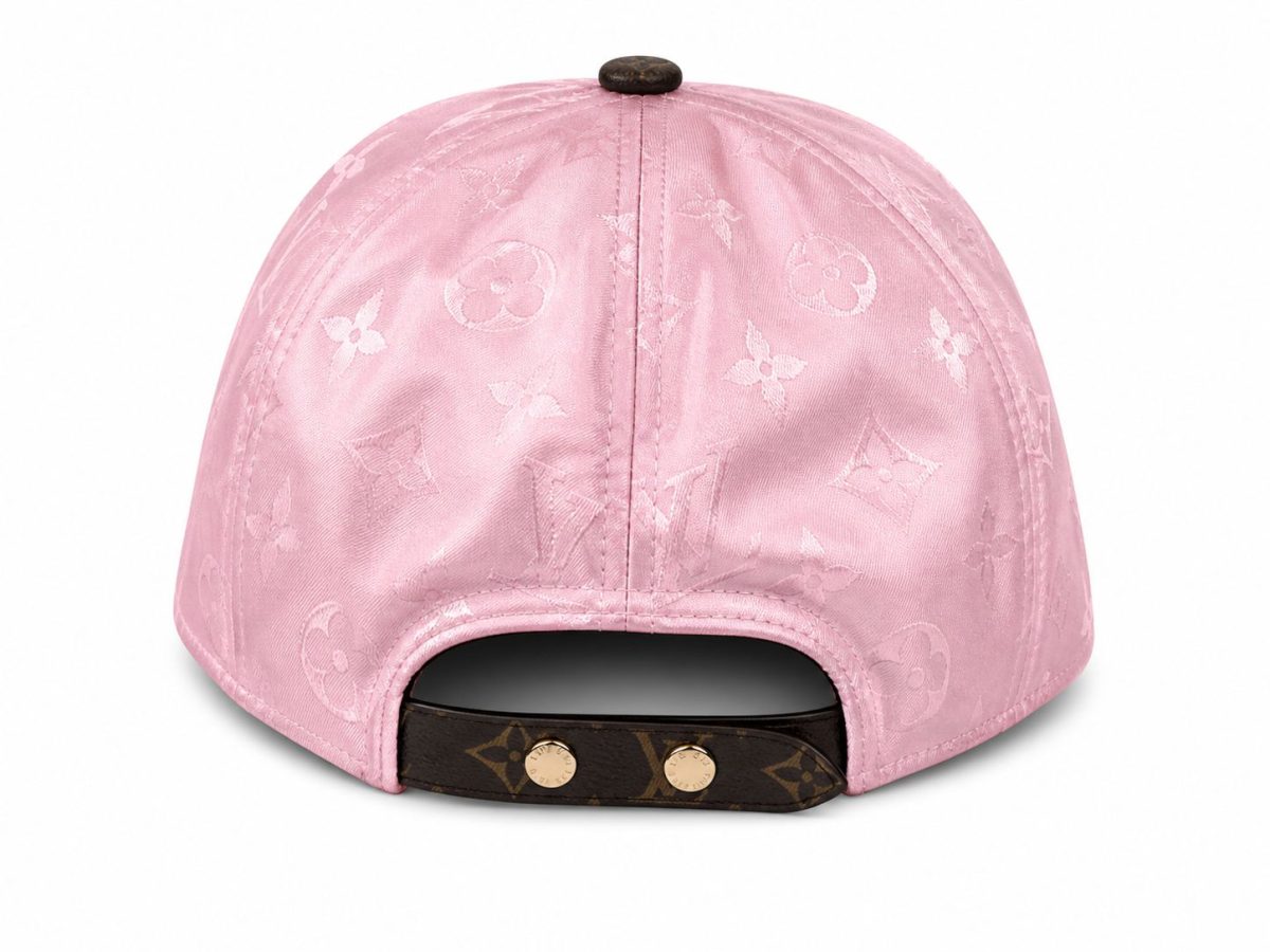 Back view of a pink Louis Vuitton cap with monogram pattern and an adjustable brown strap with gold snaps.