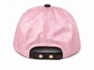 Luxury pink monogram cap with designer logo details.