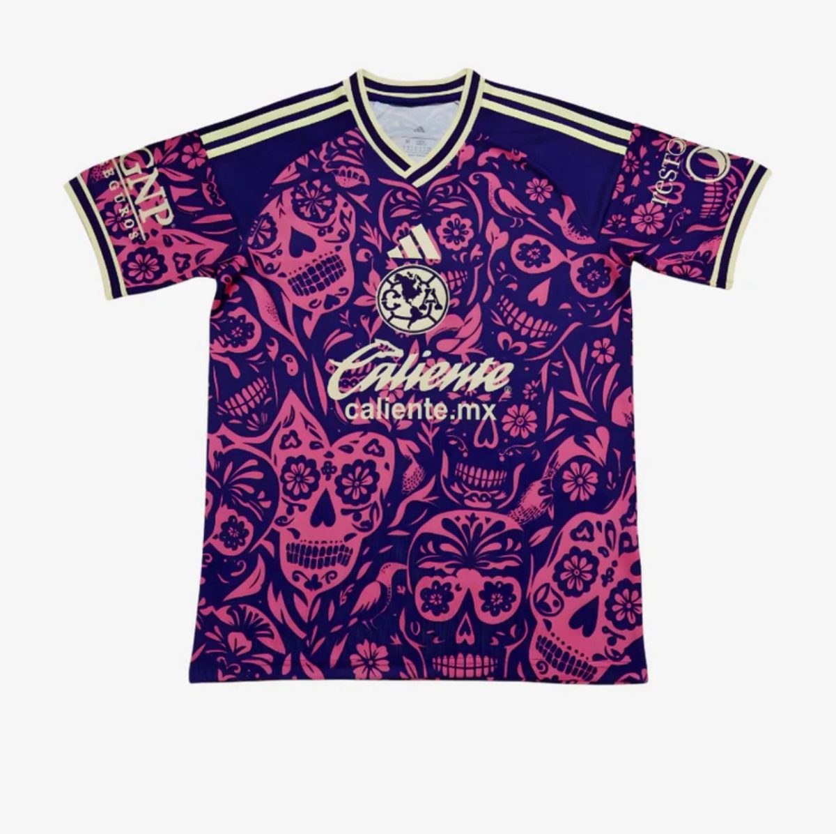 Front view of a purple and pink skull-patterned soccer jersey with Adidas logo and 'caliente.mx' sponsor text, neon trim on collar and cuffs