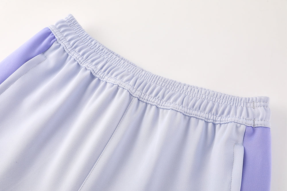 a160094b | UAE SPORT STORE Light lavender pants with an elastic waistband and purple side panels.