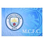 Blue flag featuring the Manchester City crest on a light blue background with MCFC text nearby.