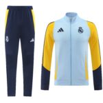 Real Madrid training tracksuit: navy pants with crest and yellow side panels, light blue and yellow zipped jacket with crest on chest2.