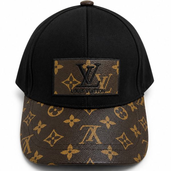 Black baseball cap with a brown LV monogram print on the curved brim and a leather LV patch on the front.