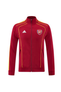 Red Arsenal track jacket with yellow piping and zip front; Adidas and club crest visible on chest.