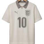 Cream England football jersey on a wooden hanger with gray collar, featuring the crest and a large number 10 on the front with a PUMA logo.