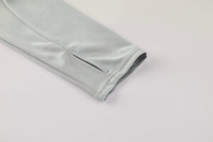 Light gray jacket sleeve with a small slit at the cuff edge (vent).