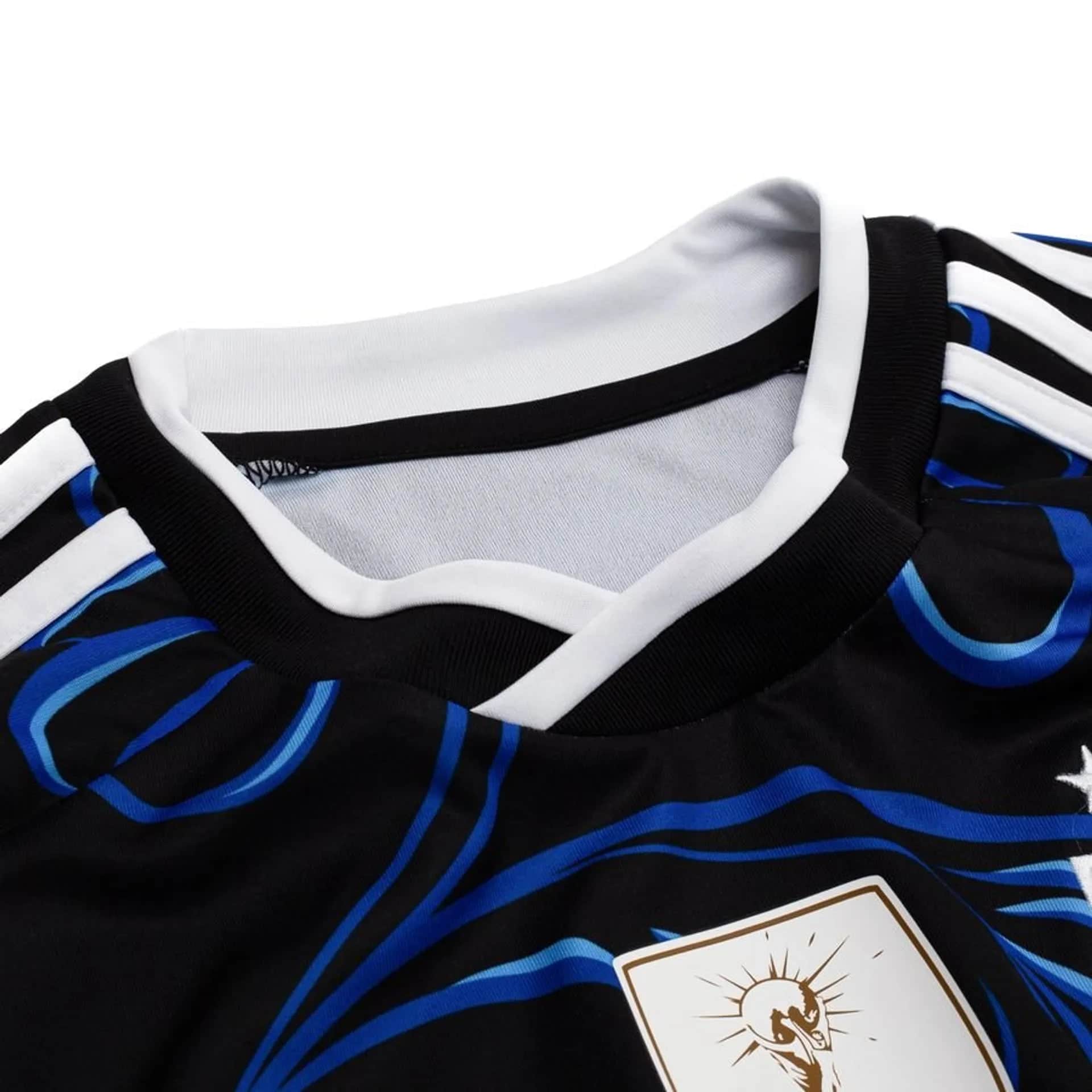 a7fa338f98d7 | UAE SPORT STORE Close-up of a black, white, and blue striped sports jersey with a partly visible playing card in the bottom-right corner showing a sun illustration