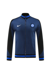 a912a1c0 | UAE SPORT STORE Navy blue track jacket with black sleeves, full zipper, blue striped collar and hem, white Nike swoosh on the right chest and team crest on the left chest.