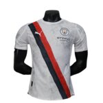 White Manchester City football jersey on a mannequin, featuring a red and navy diagonal sash and Etihad Airways logo.