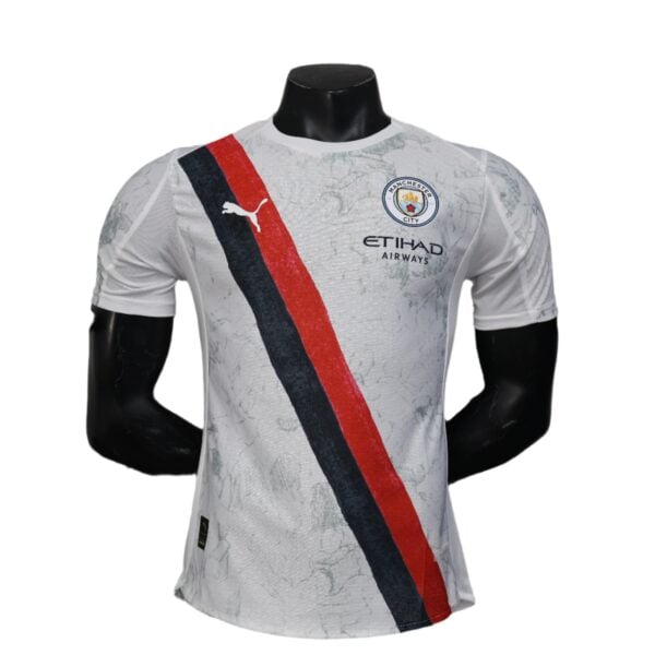 White Manchester City football jersey on a mannequin, featuring a red and navy diagonal sash and Etihad Airways logo.