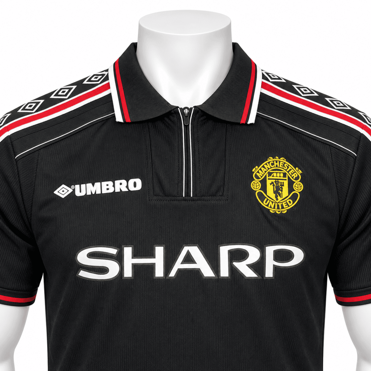 Manchester United classic away jersey 98/99 with black, red, and white colors.