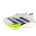 ab57bf1f-bfef-474f-b2e5-e69fb9965d5c | UAE SPORT STORE White and gray running shoe with dark blue stripes and neon yellow heel, labeled Lightstrike Pro.