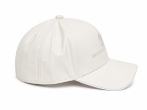 White baseball cap with a curved bill and small top button, featuring an embroidered emblem on the side.