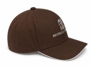 Brown baseball cap with a white embroidered crest and 'BRUNELLO CUCINELLI' text on the front, curved brim and top button visible.