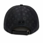 Back view of a black Louis Vuitton cap with an adjustable strap and subtle monogram pattern pattern all over the fabric