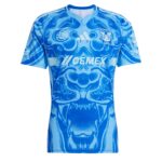 Blue athletic jersey with a dynamic tiger print and sponsor logos (CEMEX, Monterrey) and Tigres UANL crest on the chest graphic styling.