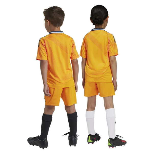 Two children wearing orange soccer uniforms facing away, standing side by side.
