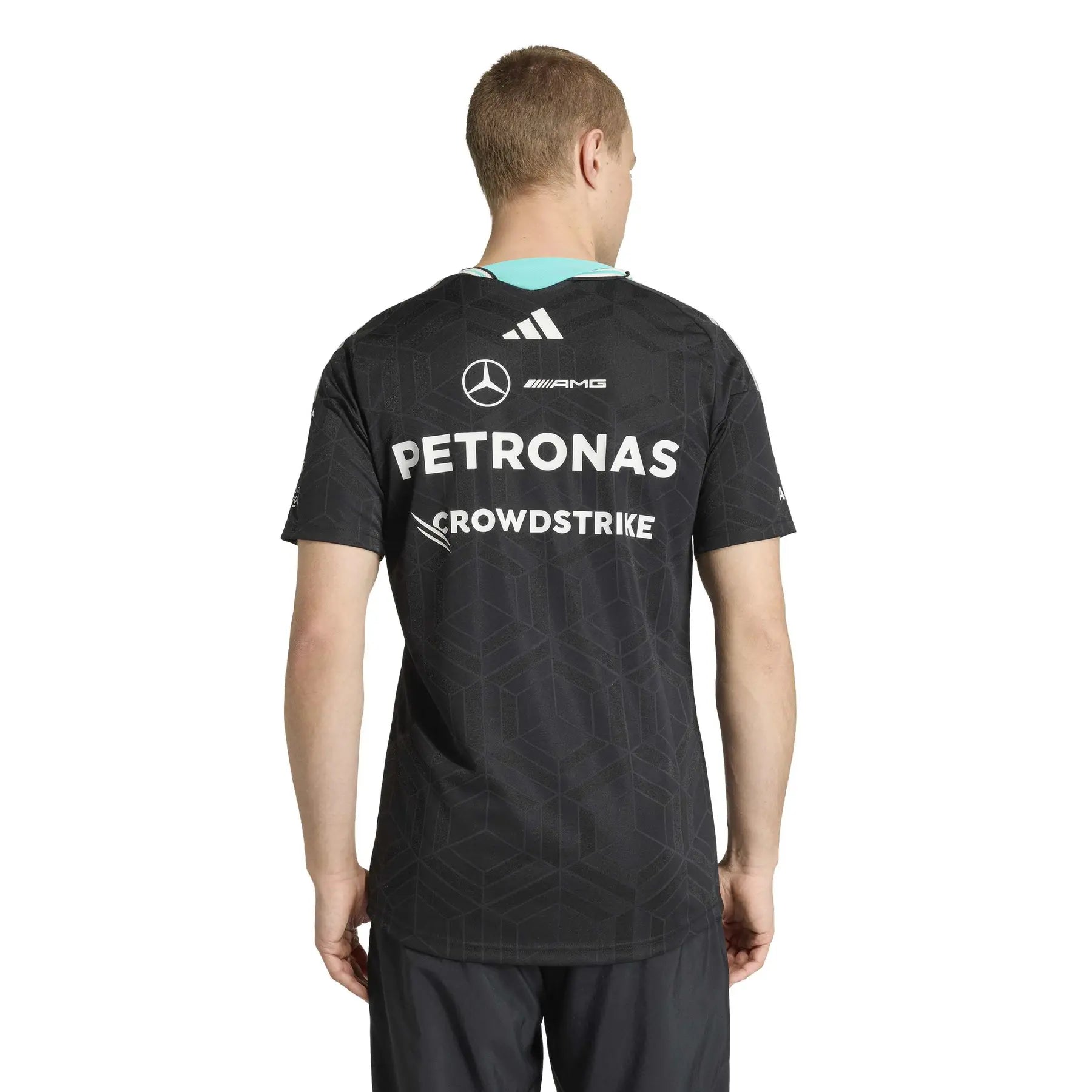adidas_ke5325_3_apparel_on_model_back_view_white | UAE SPORT STORE Back view of a person wearing a black Petronas racing jersey with sponsor logos visible on the back (Mercedes logo, AMG, Petronas, CrowdStrike). The turquoise collar is peeking at the neckline.