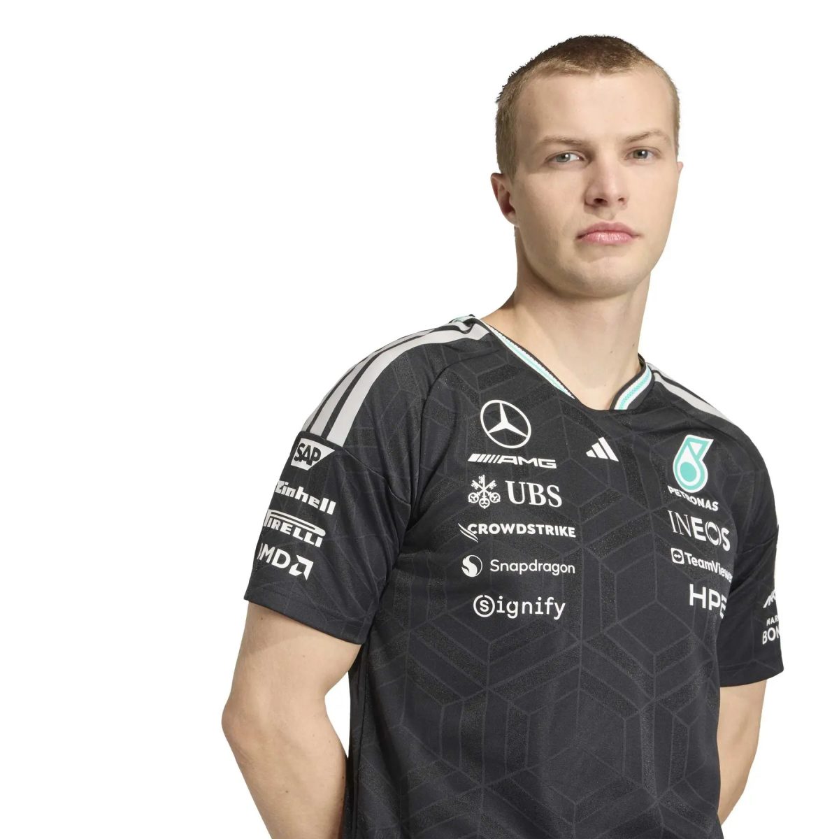 Man wearing a black, geometric-patterned sports jersey with multiple sponsor logos, facing slightly to the right.