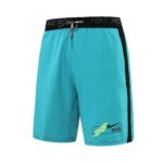 Turquoise Nike athletic shorts with a black waistband, black side stripe, and a small 'Just Do It Nike' logo near the hem from a side view.