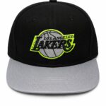 Black baseball cap with a gray curved brim and a neon-yellow-outlined Lakers logo patch on the front; features the text 'Los Angeles Lakers.'