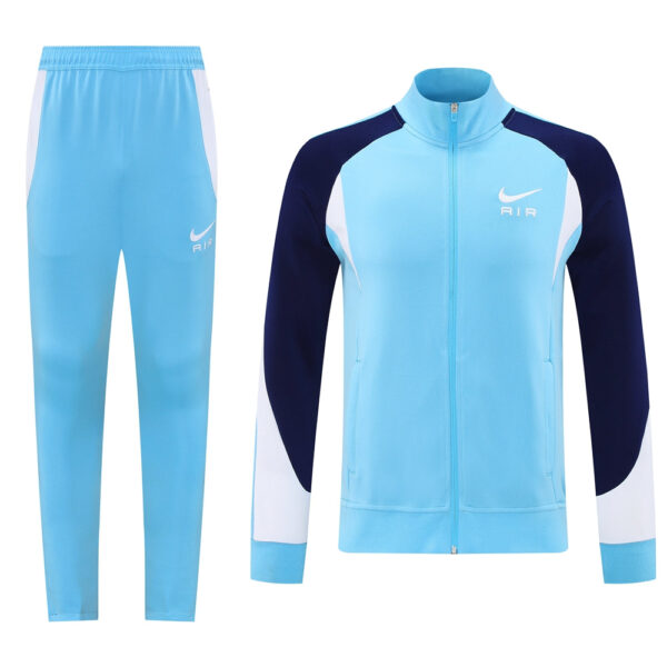 Light blue Nike Air tracksuit with navy sleeves, including a zip-front jacket and matching pants with white side panels on the legs.