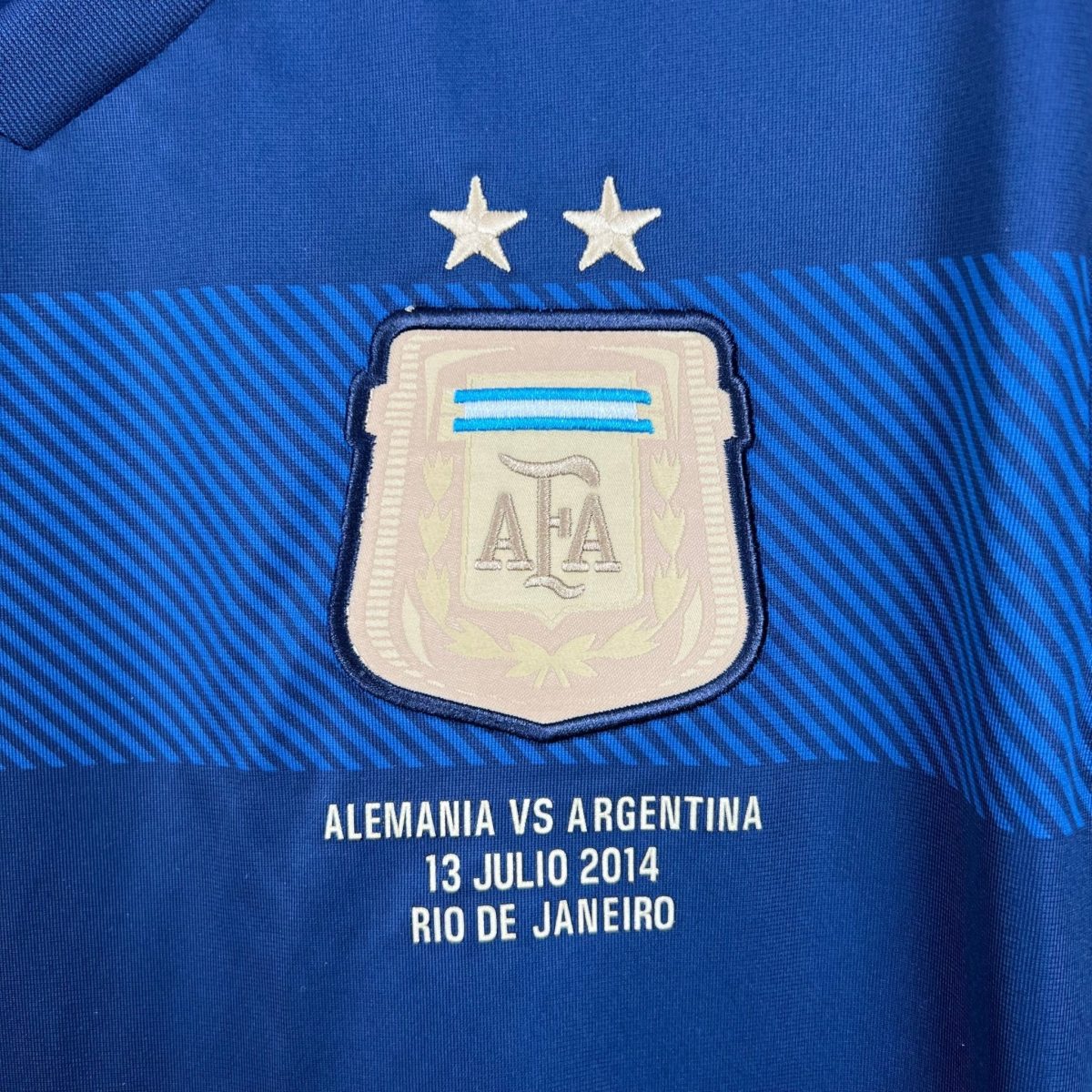 Dark-blue Argentina shirt, crest and dated match inscription close-up