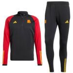 Black and red training top with yellow logo, paired with black track pants with yellow stripes on the legs
