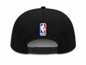 Back view of a black baseball cap with an NBA logo patch on the crown and an adjustable strap at the back.
