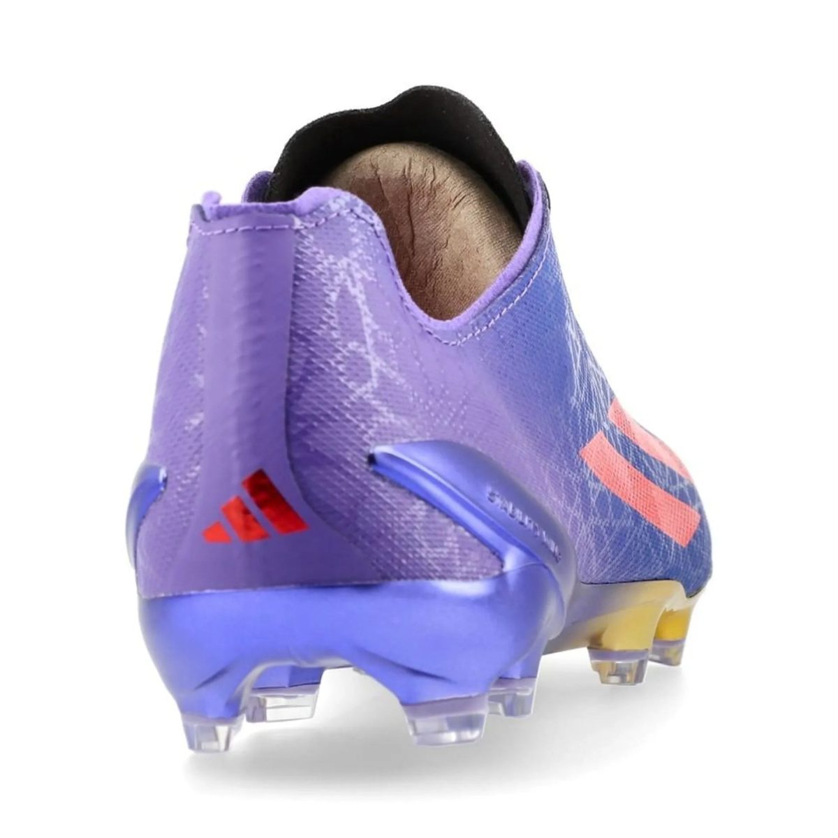 Rear view of a purple Adidas turf shoe with orange stripes and a studded blue sole on a white background.