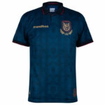 Blue polo soccer jersey with red-trimmed collar and sleeves, featuring a gold 'marathon' logo and crest with a '100' emblem on the chest.