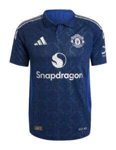 Blue Manchester United football jersey with Snapdragon sponsor on the front and club crest visible (front view).