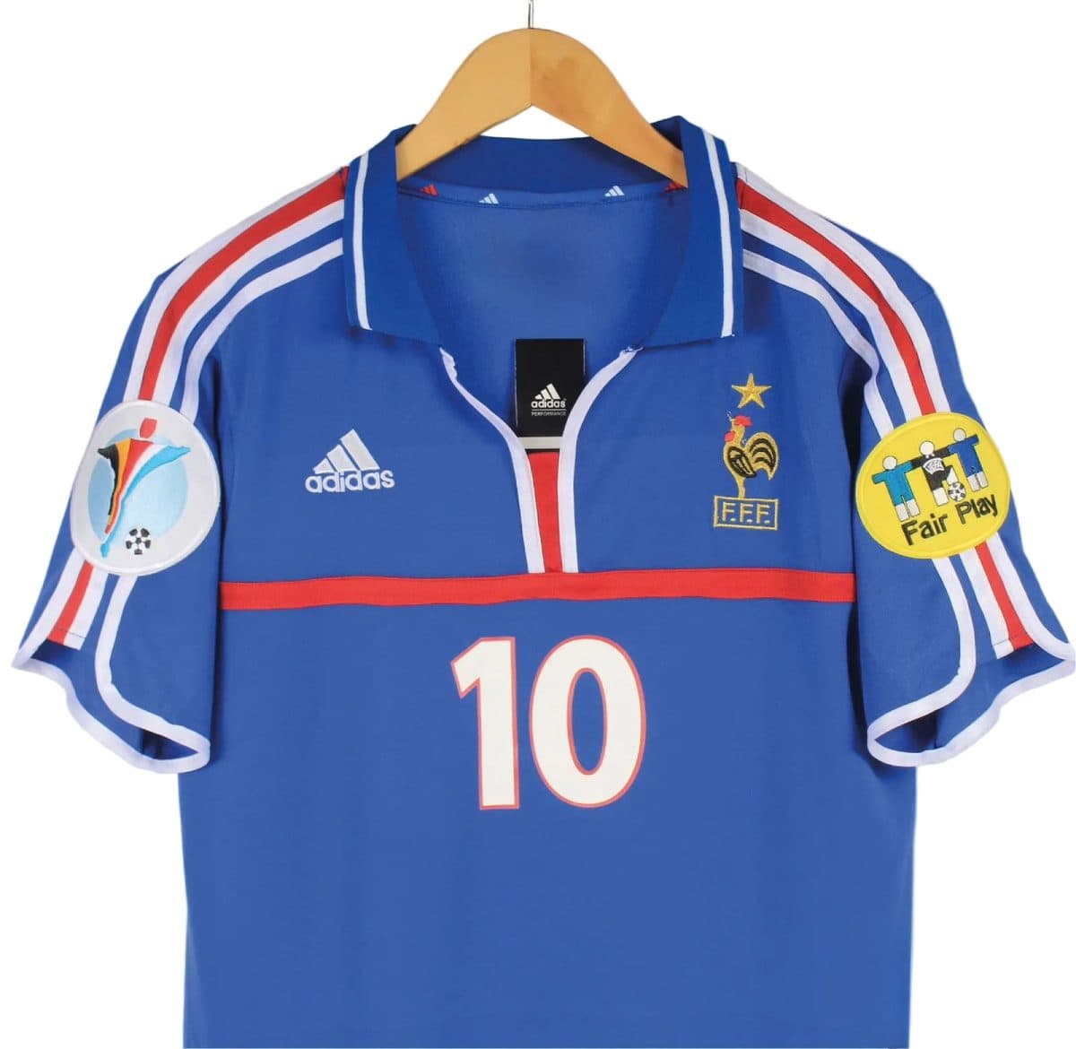Blue France national soccer jersey on a hanger, with red stripe, gold crest, and the number 10 on the front.