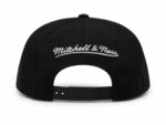 Black Mitchell & Ness snapback hat with Shadow Bulls logo.