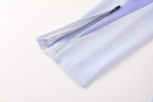 b7c1ee24 | UAE SPORT STORE Close-up of a light lavender pant leg with a small zipper at the ankle.