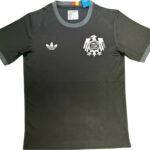 Black short-sleeve sports T-shirt with Adidas logo on the left chest and a white German football federation crest on the right chest.